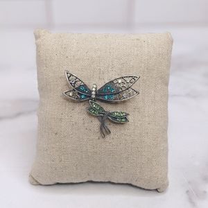 Green, blue, and gray metal dragonfly brooch